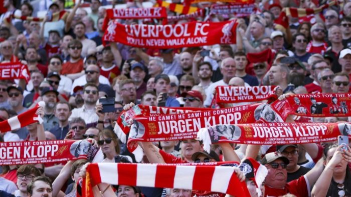 Liverpool supporters celebrate departing manager Juergen Klopp during the English Premier League soccer match of Liverpool FC against Wolverhampton Wanderers, in Liverpool, Britain, 19 May 2024.