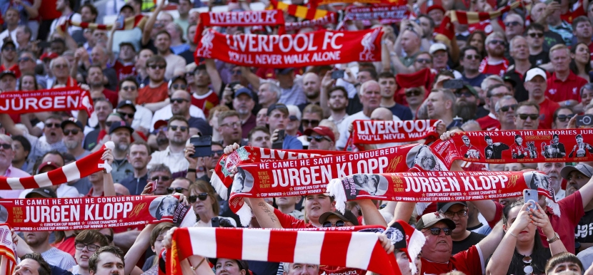 Liverpool supporters celebrate departing manager Juergen Klopp during the English Premier League soccer match of Liverpool FC against Wolverhampton Wanderers, in Liverpool, Britain, 19 May 2024.